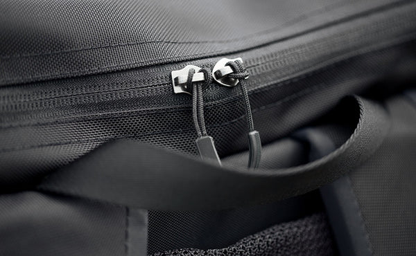 Close-up of the top pocket zipper on the Shadow Guide; we've cut the metal pulls off and have replaced them with cord pulls so you don't have to.